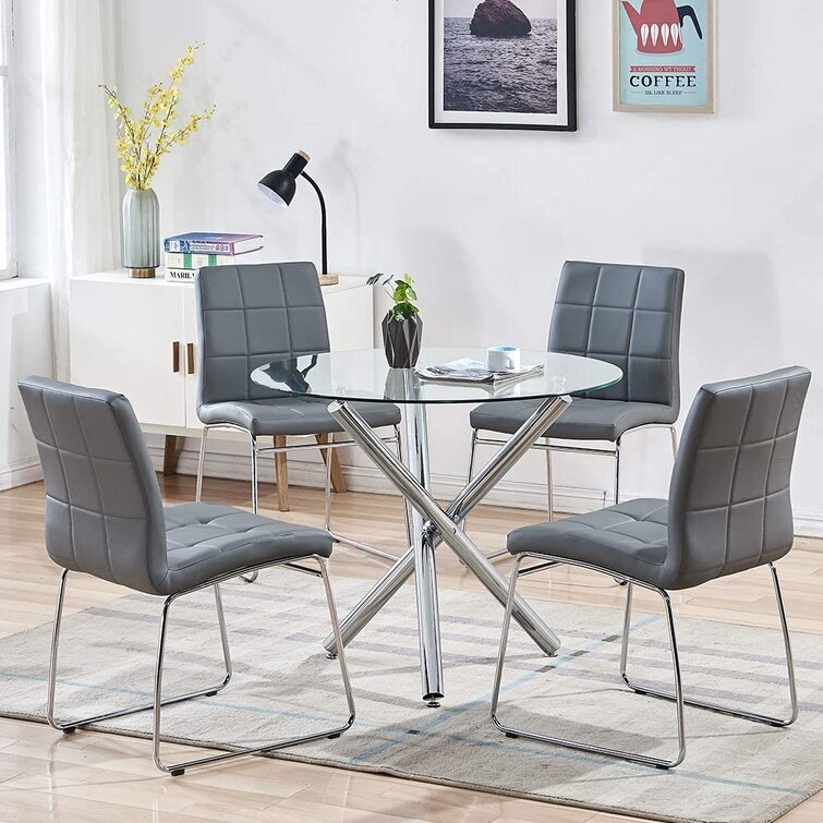 Glass dining table with four chairs hot sale